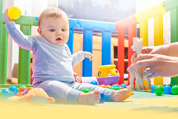 istock Baby boy showing off his plastic ball 497941474
