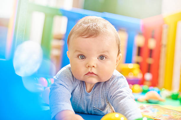 istock Baby boy in his playpen looking to camera 497942102