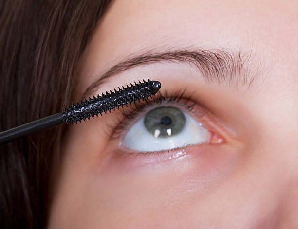 istock Woman applying mascara 497942394
