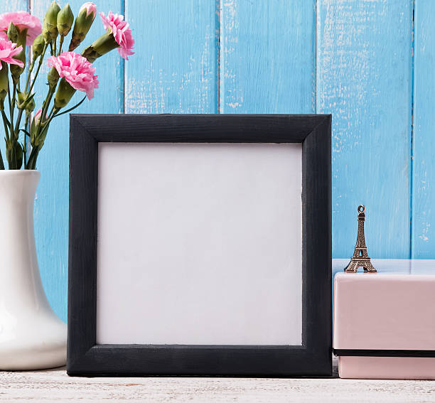 istock Blank frame, pink flower and souvenir Eiffel tower. 497942674