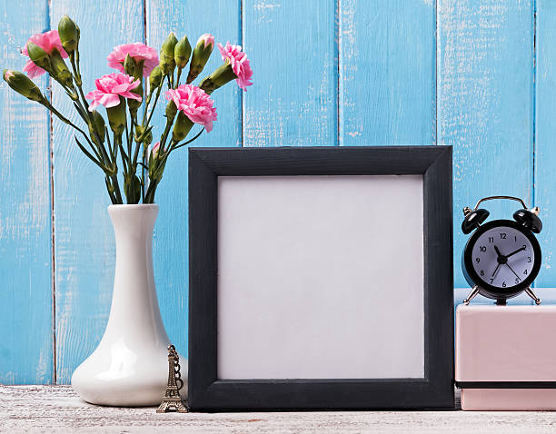 istock Blank frame, pink flowers, alarm clock and souvenir Eiffel tower 497942738