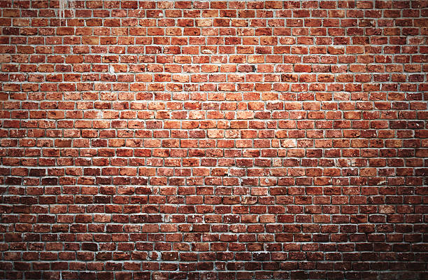 Brick wall Old brick wall background with vignette effect. brick wall photos stock pictures, royalty-free photos & images