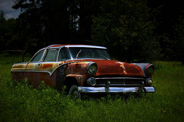 istock Abandoned Vintage Car Parked in a Field 497946788