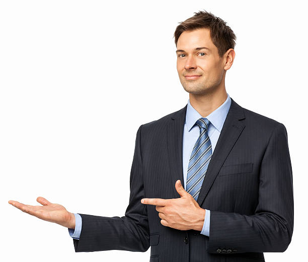 Confident Businessman Pointing At Invisible Product