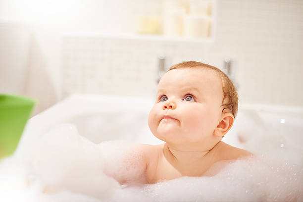istock Baby boy sat in the bath 497947126
