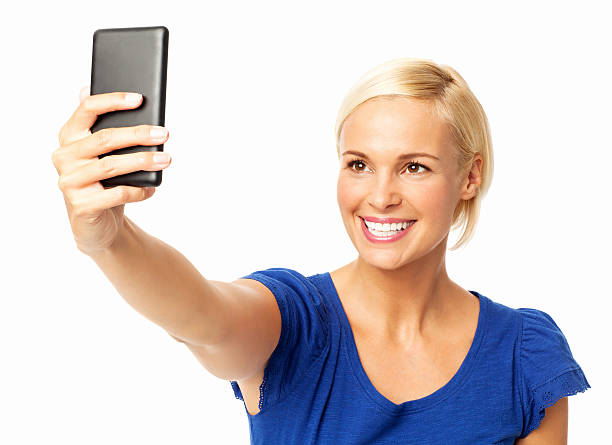 istock Woman Taking Selfie Through Smart Phone 497947199