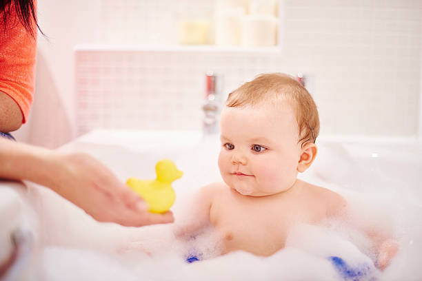 istock Baby boy playing with his rubber ducky 497947388