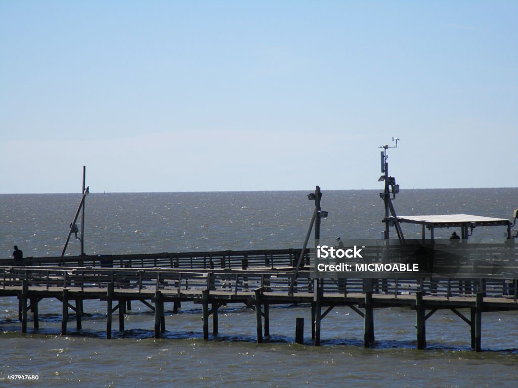 FISHING PIER AT CEDAR POINT A view of the Cedar Point fishing pier near Dauphin Island, Alabama. 2015 Stock Photo