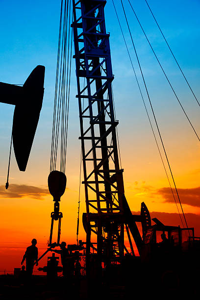 istock oil field, the oil workers are working 497948322
