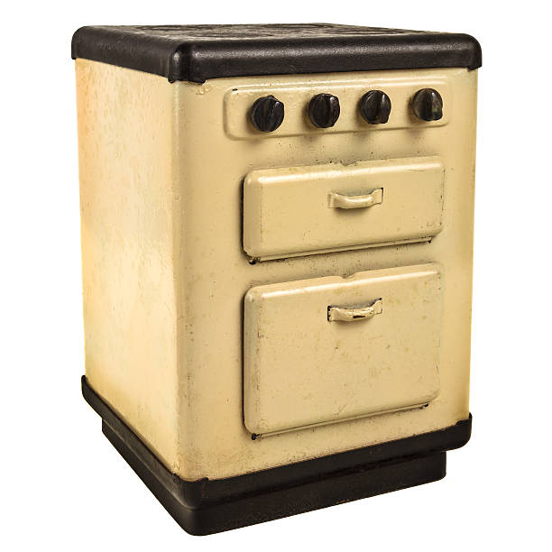 istock Retro doll house cooking stove isolated on white 497953285