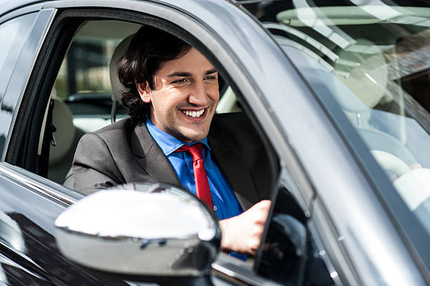 istock Handsome businessman driving a luxurious car 497953799