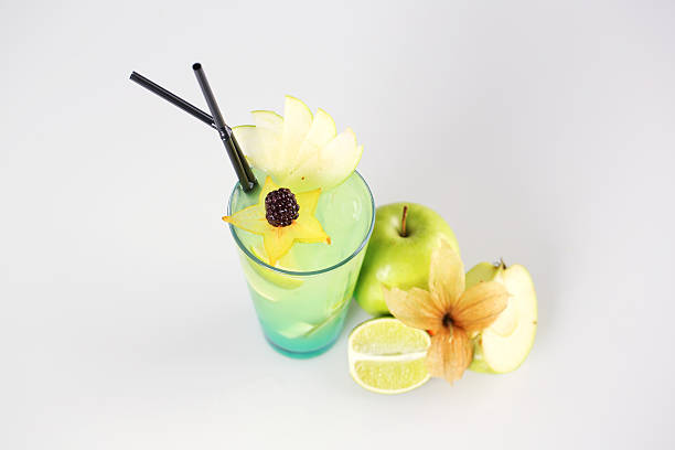 Delicious fresh green cocktail on gray studio background