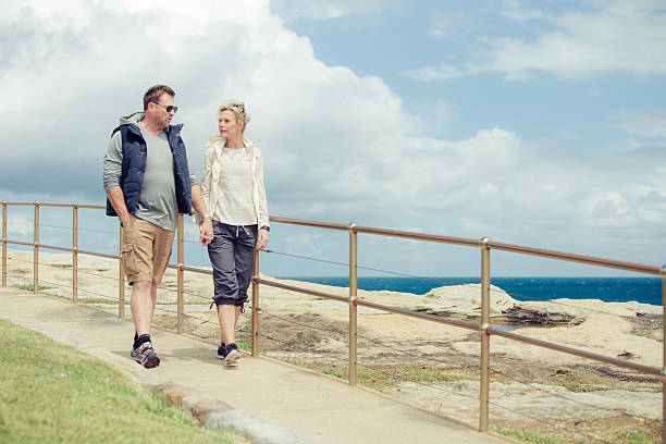 istock Mature couple walking along the coast 497956408