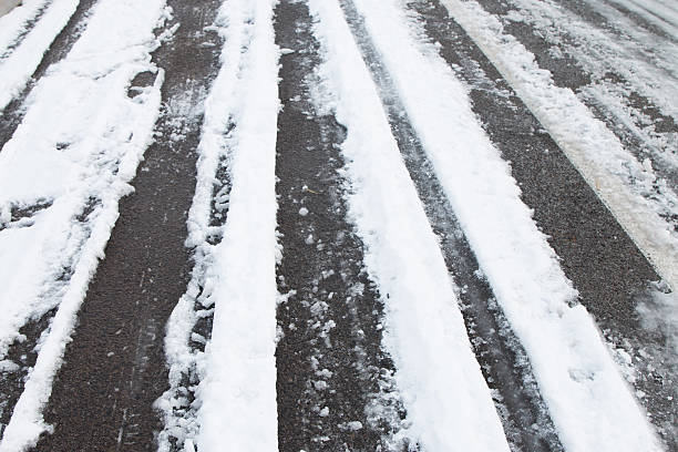 istock Car tire track in snow 497956912