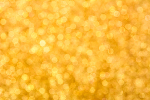istock Sparkle glittery gold bokeh abstract background 497958120