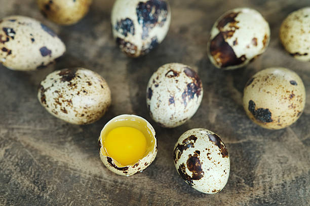 istock close up break quail egg and quail eggs on background 497958356