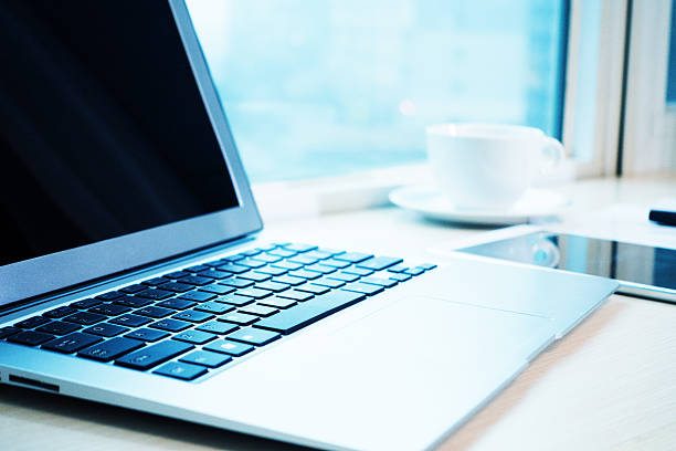 istock Laptop and a cup of coffee on office desk 497961444