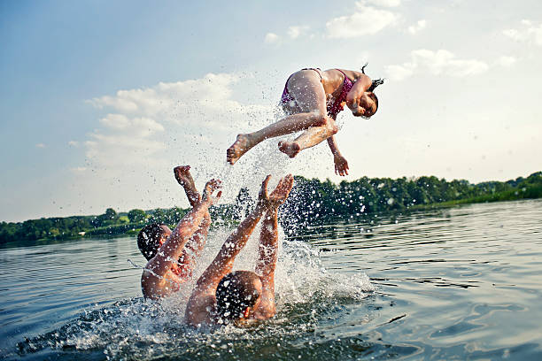 People in water People in water jumping into water stock pictures, royalty-free photos & images