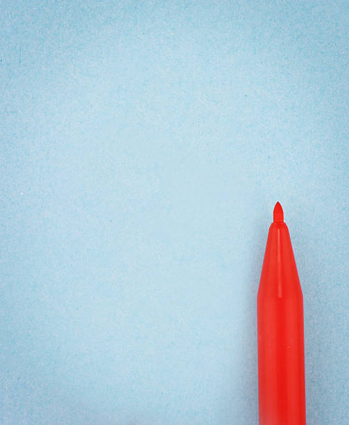 istock Red pen on the blue paper 497962886