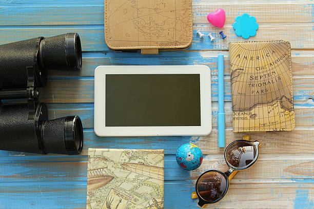 istock Tablet computer in the middle and travel equipment 497964976