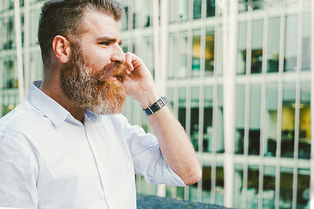 istock Businessman On His Mobile Phone Outdoors, Office Building On Background 497965160