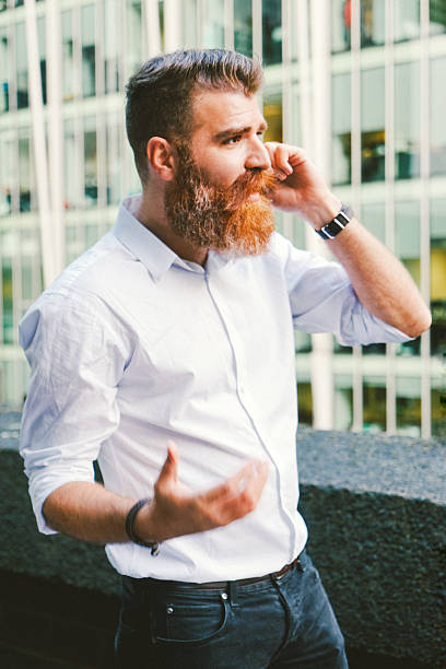 istock Businessman On His Mobile Phone Outdoors, Office Building On Background 497965286
