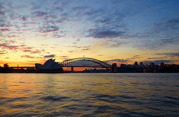 istock Sydney Skyline Sunset Silhouette 497965388