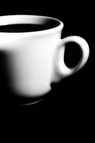 istock cup of coffee on black background 497970262