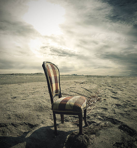 istock Wooden chair alone on Sand 497971002