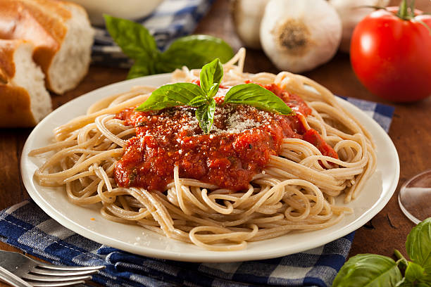 Homemade Spaghetti with Marinara Sauce Homemade Spaghetti with Marinara Sauce and Basil marinara stock pictures, royalty-free photos & images