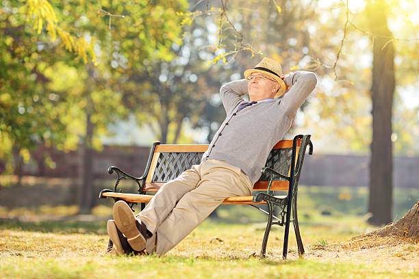 istock Senior man relaxing in park on a sunny day 497975831