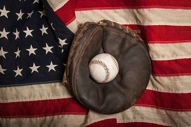 istock Vintage baseball glove on an American flag 497976271