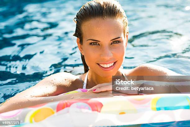 Woman Relaxing In A Pool Stock Photo - Download Image Now - Adult, Adults Only, Beautiful People