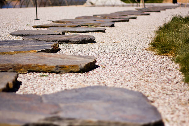 Japanese stone rocks acting as steps in a garden in black and white