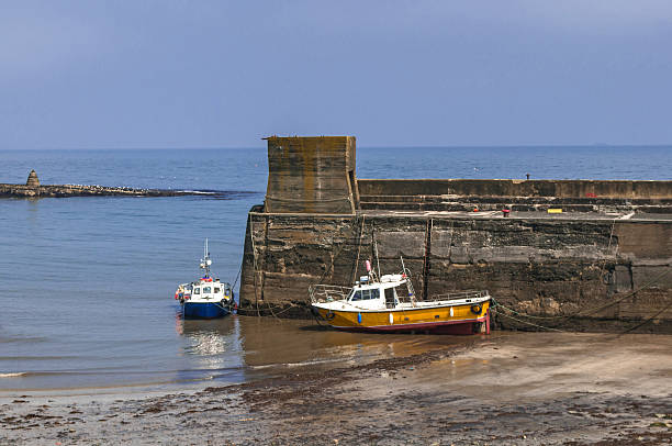 istock Fishing Boats Moored by Harbour Wall 497978187