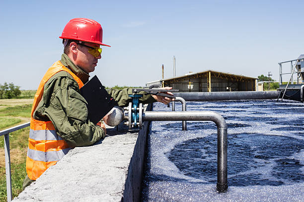 istock Worker monitor filtering water 497978325