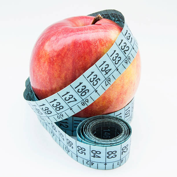 Apple and tape measure stock photo