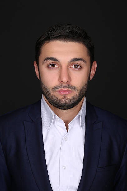 istock Studio portrait of handsome man in a suit isolated over 497985054