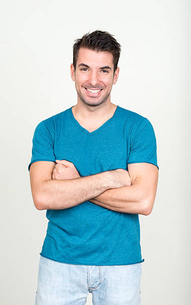 istock Hispanic man with crossed arms smiling 497985542