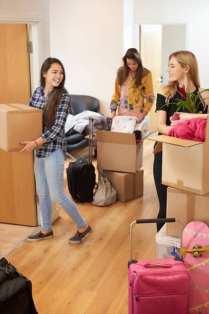 istock female students moving into new flat 497987896