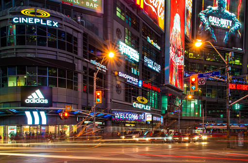Dundas Square at night time, long exposure. The Toronto landmark is one of the busiest intersection in the city. Yonge-Dundas Square was first conceived in 1997 as part of revitalizing the intersection, and was designed by Brown and Storey Architects.