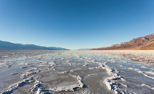 Badwater Basin in Death Valley National Park after a recent and rare rainfall which created a water surface on the usually salt flats.