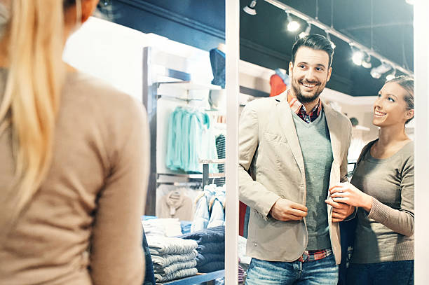 istock Couple buying clothes at department store. 497991916