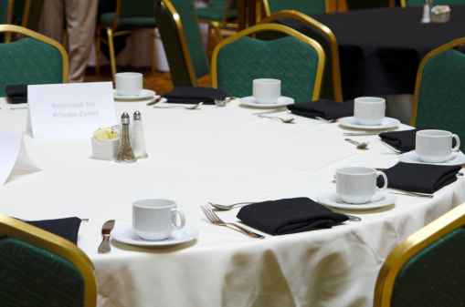 A table has been set for dining at a meeting in a Conference Center.