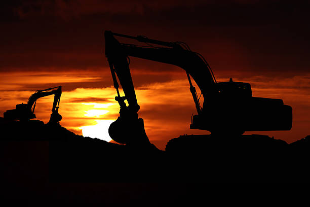 istock picture of a big bulldozer on a sunset 497992575