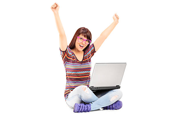 istock Woman working on laptop and gesturing success 497992881