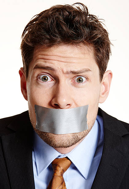 istock Awkward surprised tape mouthed businessman 497993123