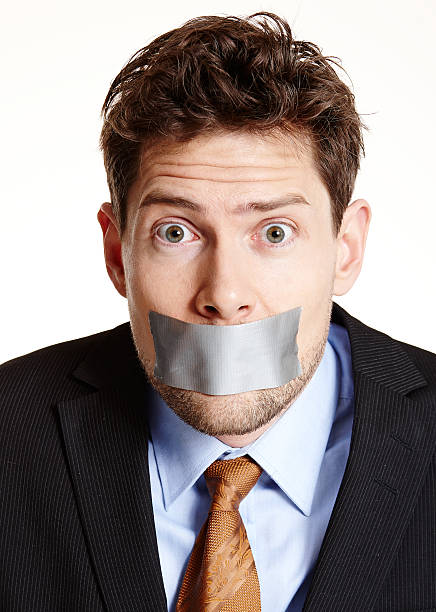istock Bewildered tape mouthed businessman 497993129