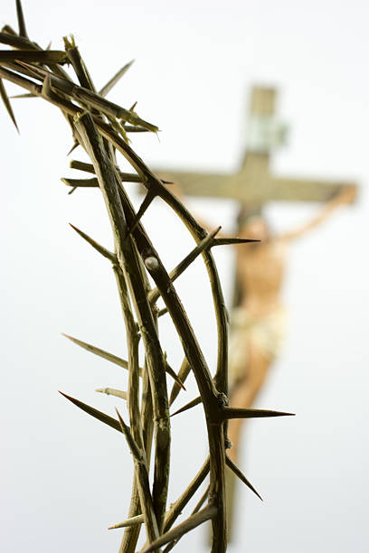 istock Crown of thorns with a Crucifix in the background 497995170