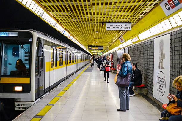 People waiting for a train in Milan subway station stock photo